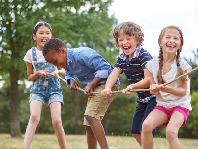 Children,Playing,Tug,Of,War,At,The,Park